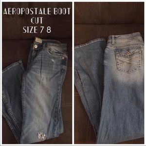 Light wash distressed boot cut denim